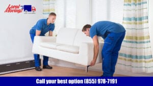 Two men moving a couch in a living room.