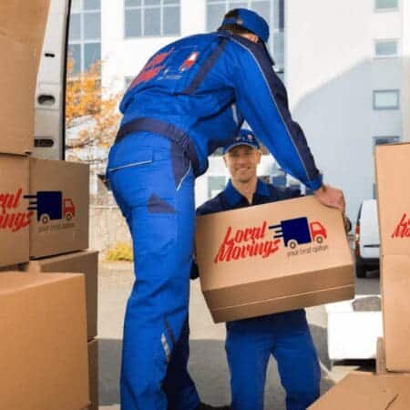 Two men loading boxes into a moving truck full of Buy 5 Hours.