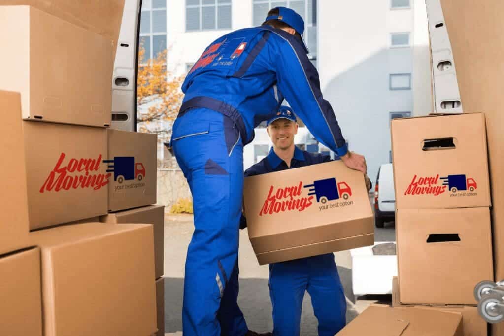 Two men loading boxes into a moving truck full of Buy 5 Hours.